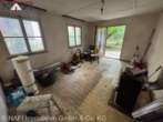 Wohnzimmer - ** Rohdiamant für Familien und Investoren – Mehrgenerationenhaus mit großem Entwicklungspotenzial **